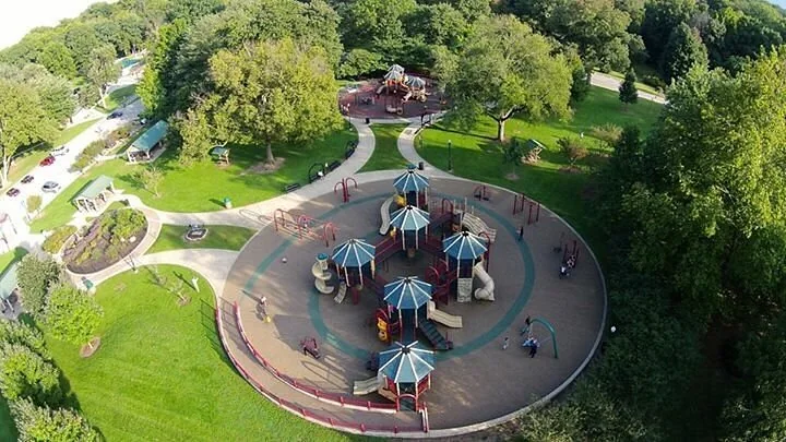 An overhead view of the playground among Deming Park’s trees